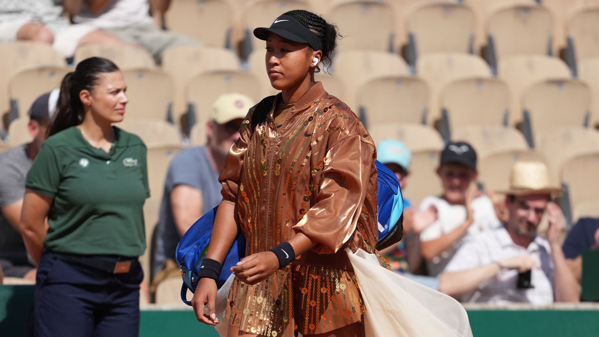 Osaka advances at French Open while fashion entrances spark debate
