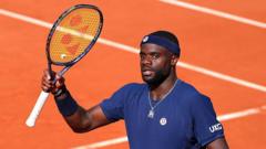 Tiafoe recovers lost racquet after French Open crowd celebration